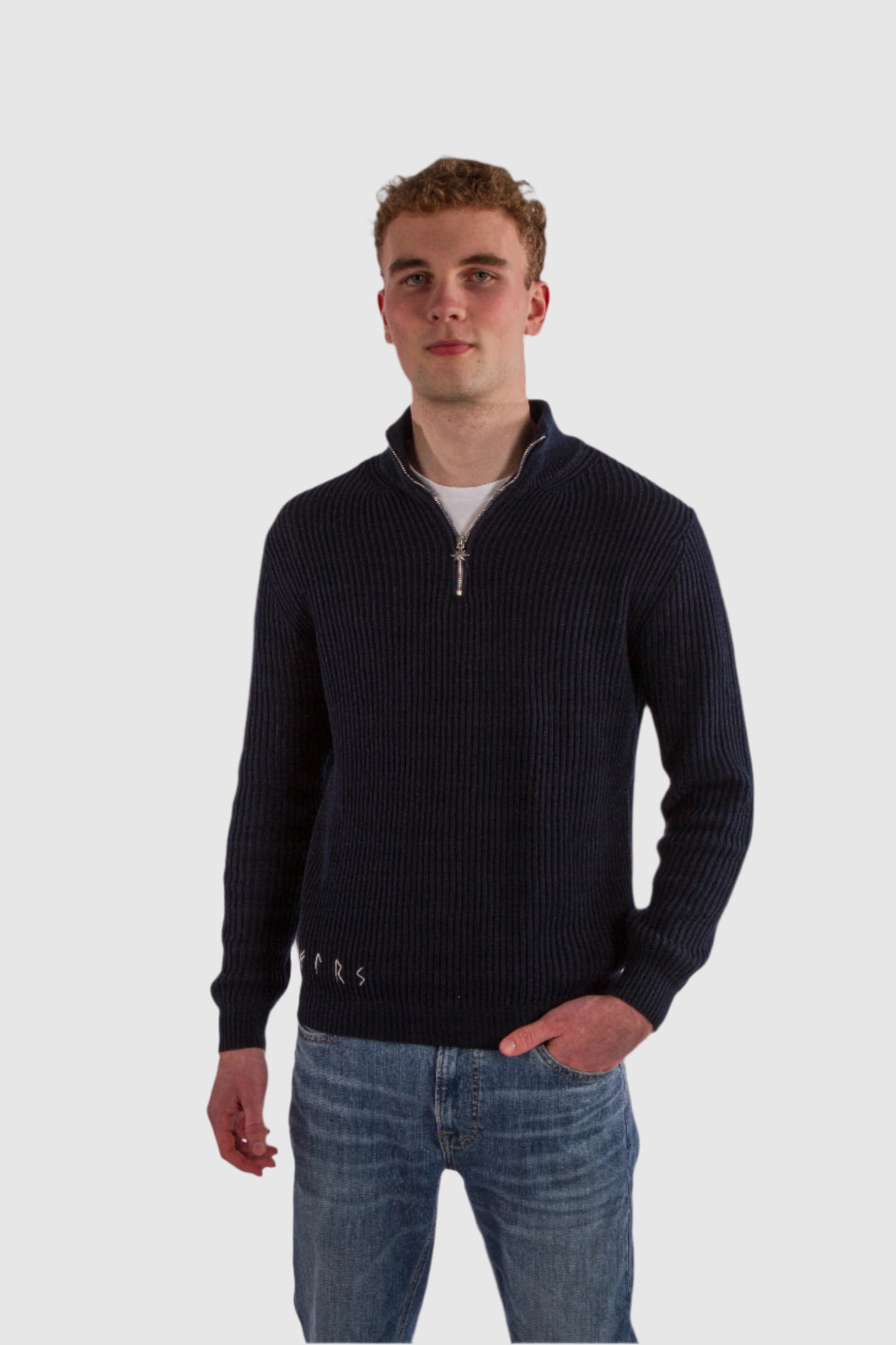 Njord model wearing navy blue ribbed half-zip cotton sweater