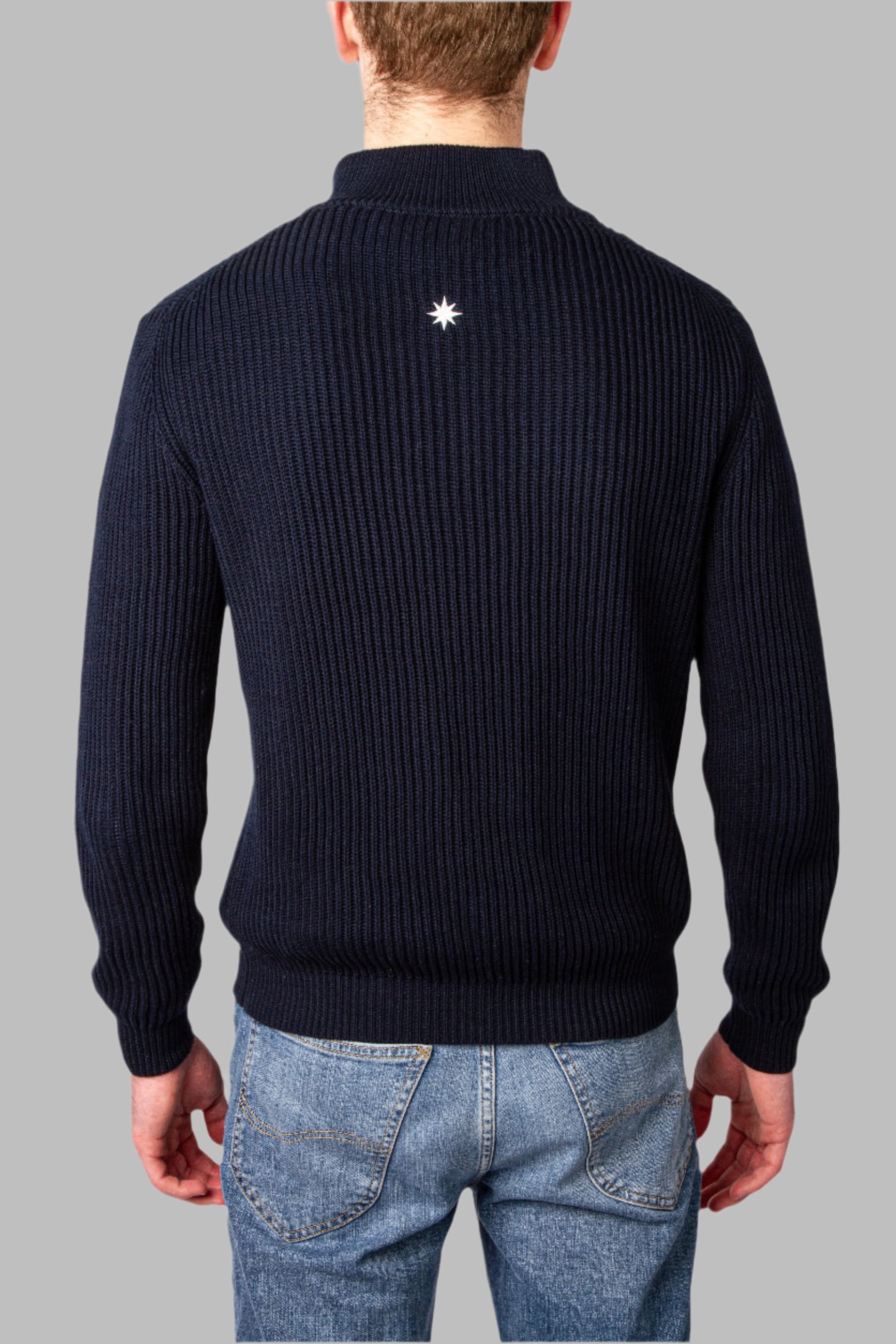 Back view model wearing navy blue half-zip sweater